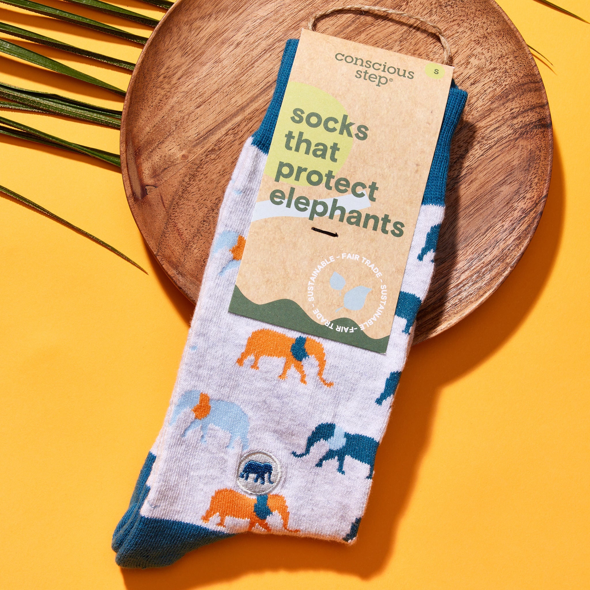 Socks that Protect Elephants by Conscious Step — gray organic cotton crew socks with orange and blue elephants