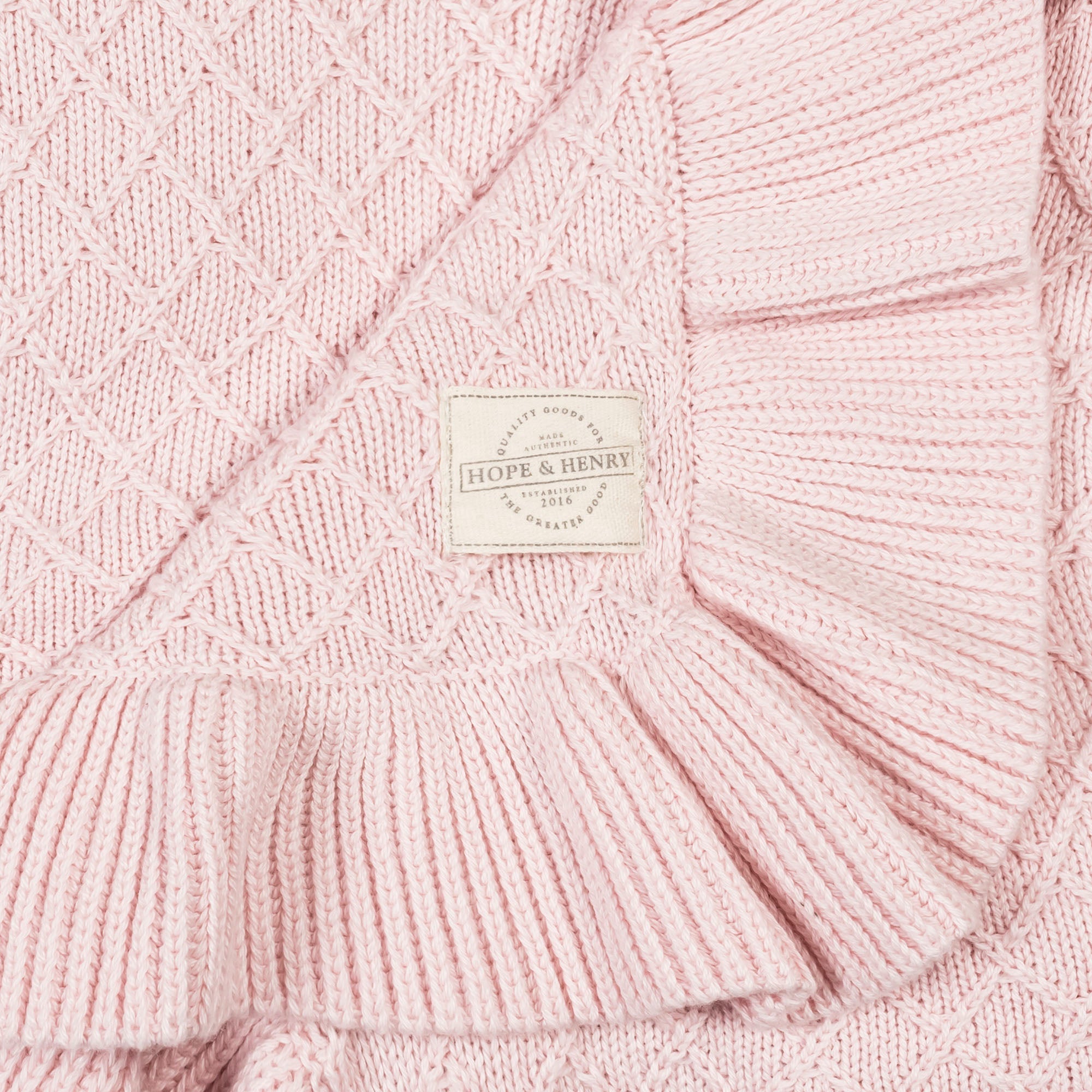 Organic Ruffle Edge Baby Blanket in Pale Pink Ruffle — detail view