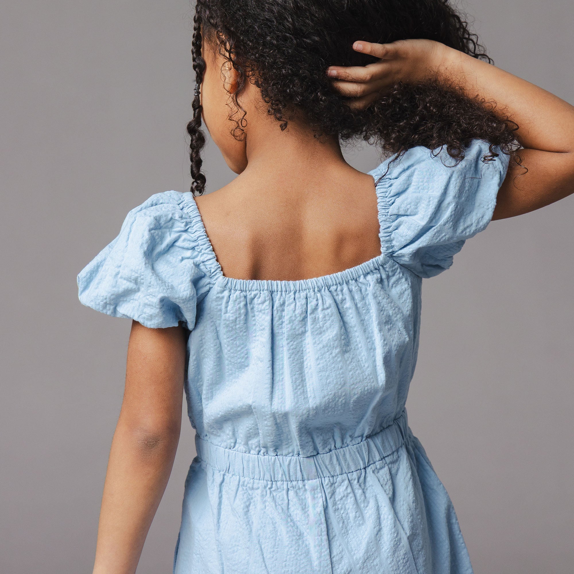 Organic Puff Sleeve Seersucker Romper in Bluebell — detail view