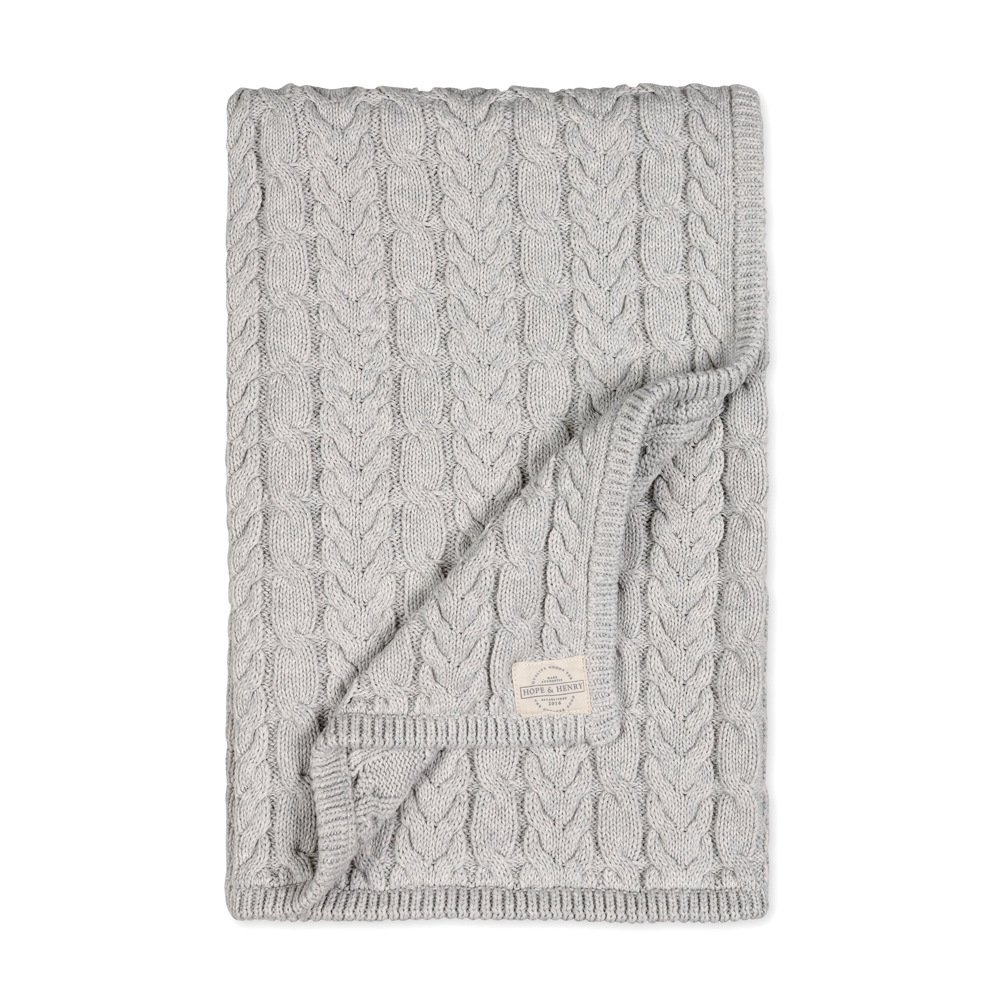 Organic Cable Knit Blanket in Light Gray Heather Cable — styled flat