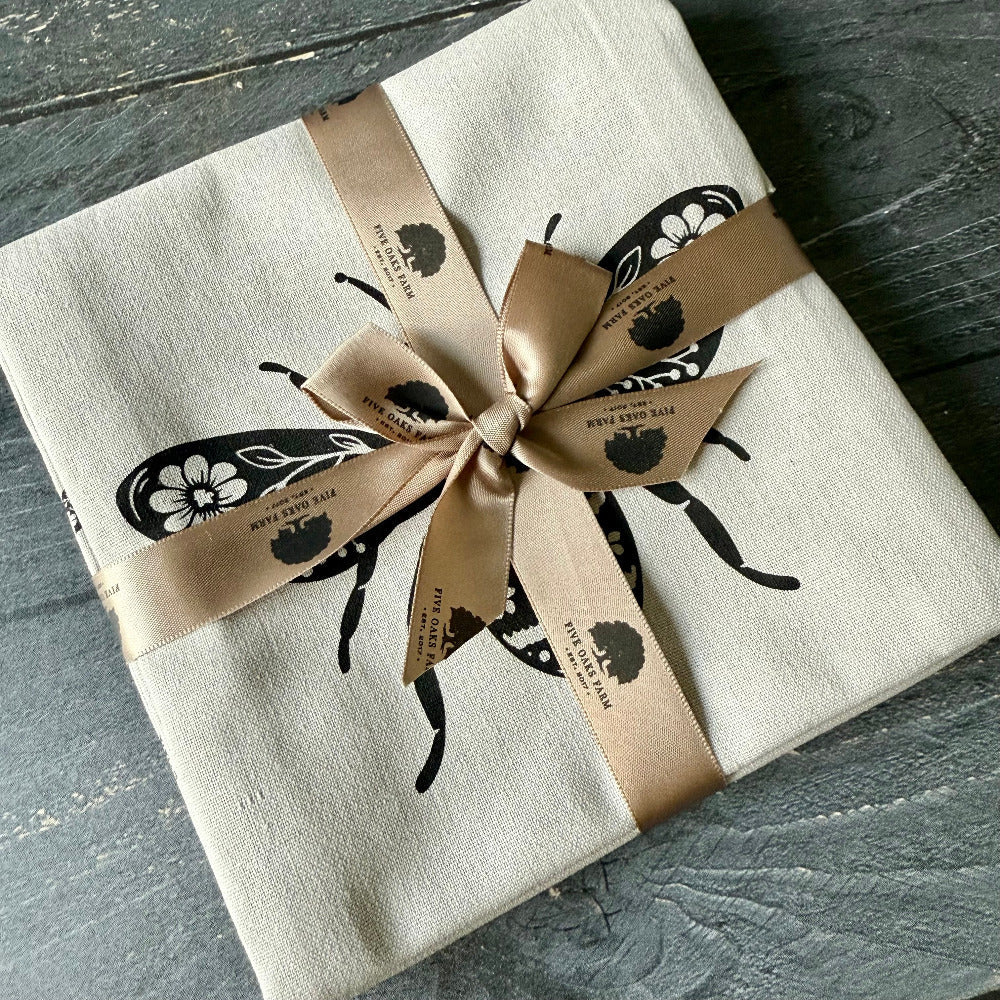 Linen-cotton bee tea towel styled in a farmhouse kitchen