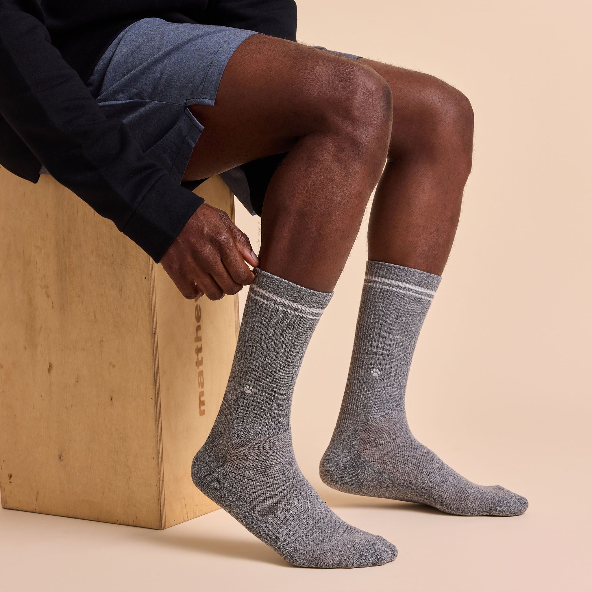 Comfort Crew Socks that Save Dogs — ribbed organic cotton crew socks in gray & black, paw print embroidery