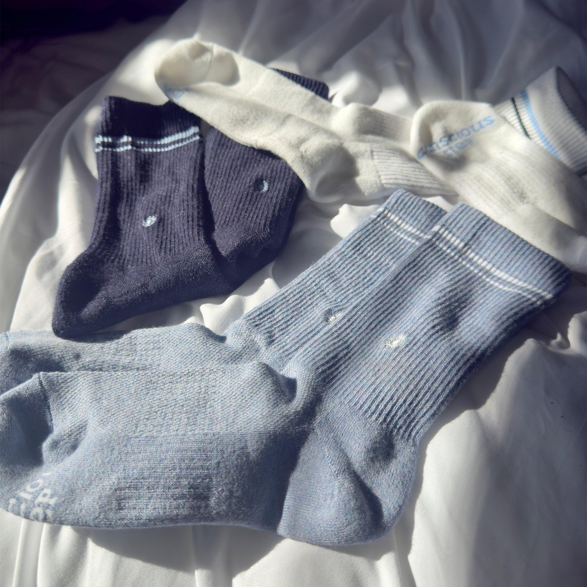 Comfort Crew Socks that Support Mental Health — ribbed organic cotton crew socks, white/blue/navy, supports NAMI