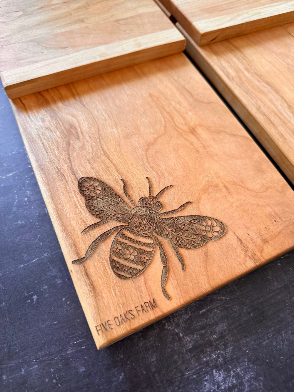 Vertical cutting board with engraved bee or wildflowers detail — Five Oaks Farm