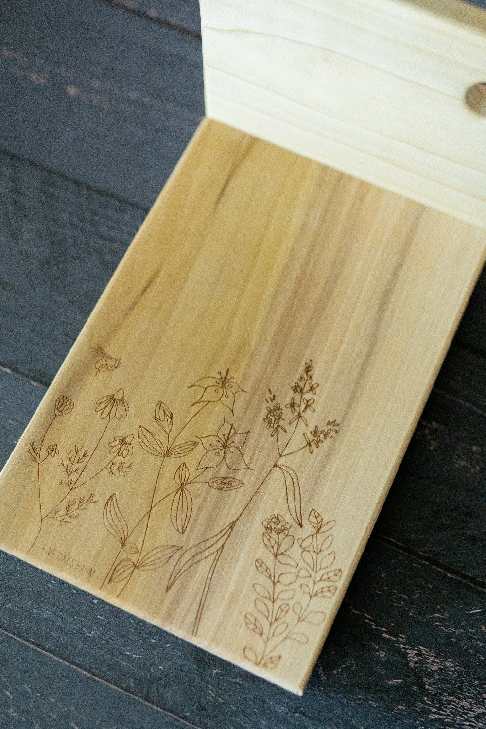 Vertical cutting board bracing a loaf of bread for slicing — Five Oaks Farm