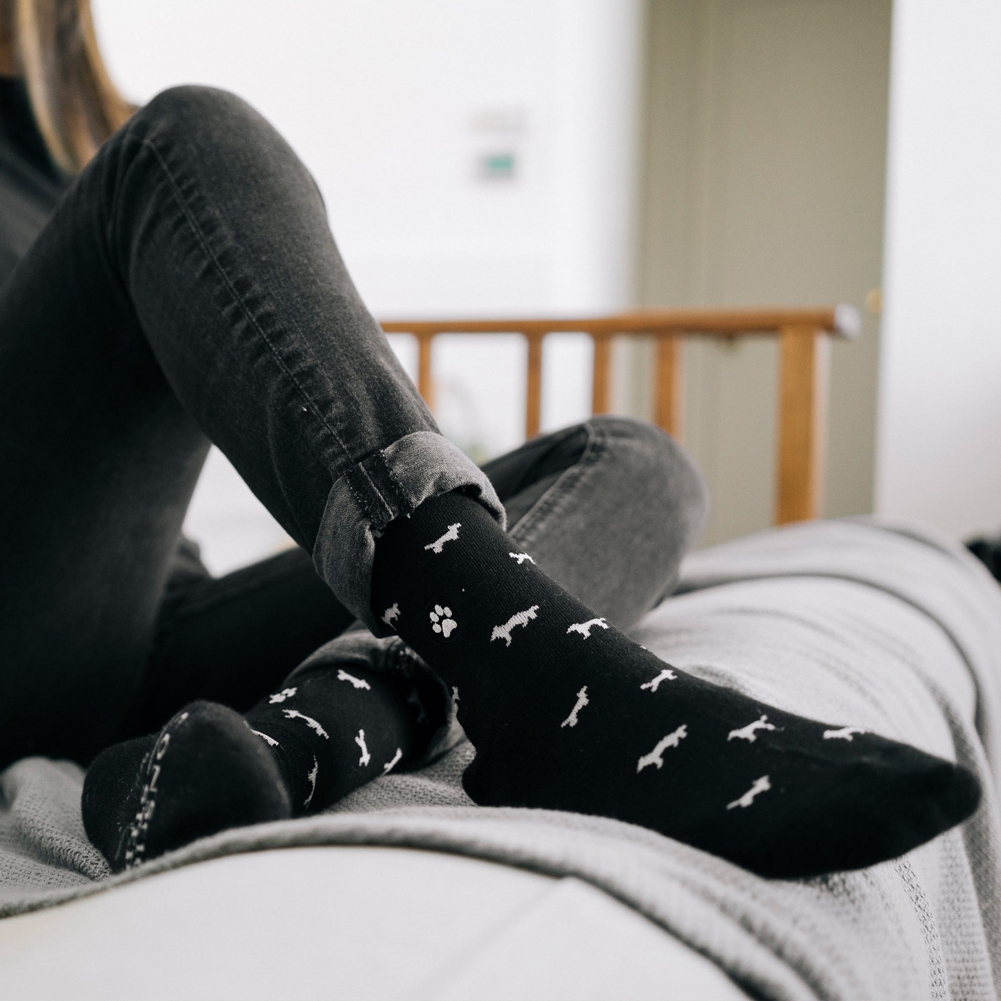 Close-up of pup-pattern sock design — Conscious Step