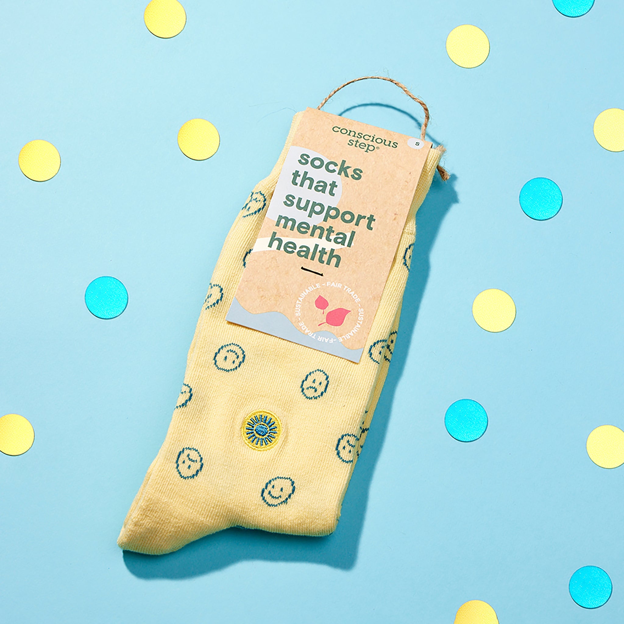 Close-up of smiley-face sock pattern — Conscious Step